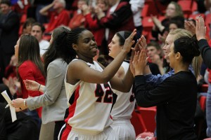 Former Youngstown State basketball forward Brandi Brown is congratulated by her teammates after a victory late in the 2012-13 season. Brown will travel to Sweden on Friday and play professional basketball with the Solna Vikings of the Damligan. Photo by Dustin Livesay/The Jambar