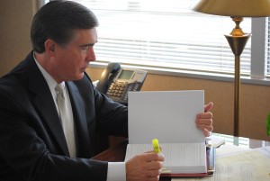Ted Roberts reviews legal documents located in downtown Youngstown. Roberts is the newest member on the YSU Board of Trustees. Photo by Frank George/The Jambar.
