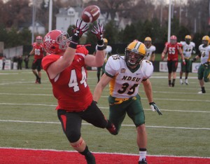 Youngstown State's Nate Adams (44) catches a touchdown pass from third-string quarterback Tanner Garry while being defended by North Dakota State's Christian Dudzik (35) late in the third quarter during Saturday's matchup at Stambaugh Stadium.  Photo by Dustin Livesay  |  The Jambar