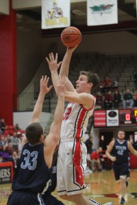 Youngstown State's Ryan Weber (33) goes up for a lay-up while being defended by Westminster's Jason Pilarski (33) during the first half of Saturday's matchup at the Beeghly Center. Photo by Dustin Livesay  |  The Jambar.