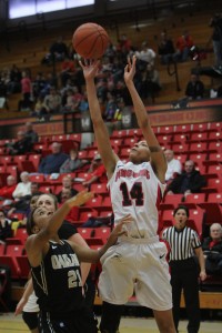 Karen Flagg attempts a jump shot over Oakland's Nola Anderson at Beeghly Center on Saturday. Flagg finished with 11 points and nine rebounds in Youngstown State's 79-64 victory. Photo by Dustin Livesay/The Jambar