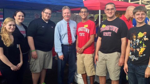Tom Letson (center-left), a Democrat member of the Ohio House of Representatives and current candidate for a seat on the Supreme Court of Ohio, stands with Ernie Barkett (center-right), president of the newly re-formed College Democrats, at a recent YSU tailgate. Though member numbers began to dwindle after the 2012 presidential election, the upcoming November elections brought new life into the group. photo courtesy of Ernie Barkett.