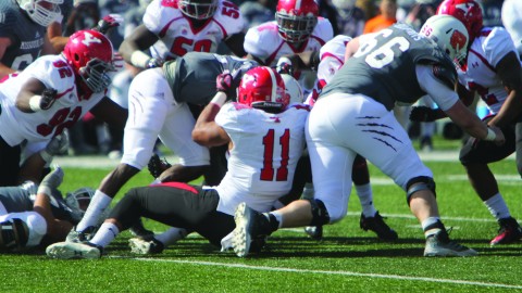 Youngstown State University's Derek Rivers (11) tackles Missouri State's Ryan Heaston (23) during Saturday's matchup at Missouri State University in Springfield, Missouri. The Penguins defeated the Bears 14-7, behind a strong defensive performance. Photo by Dustin Livesay/ The Jambar. 