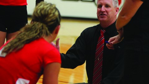 Youngstown State University volleyball coach Mark Hardaway talks to his team during a timeout against Wright State University on Sept. 27 at the Beeghly Center. The Penguins swept the Raiders 3-0.Photo by Dustin Livesay/The Jambar.