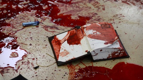 Blood stains the floor of a synagogue where at least four Israelis were killed and eight injured by two Palestinians armed with a pistol, knives and axes. Suffering on both sides of the Israel-Palestine conflict is evidence of the violence spreading through the region.  (Kobi Gideon/Rex Features/Zuma Press/TNS)