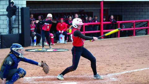 Pitcher Kayla Haslett (24) was called on to pinch hit with two outs in the bottom of the seventh inning. Haslett’s infield single scored the game-winning run to lead YSU to a 2-1 win over Oakland University on April 1. Photo by Dan Hiner/ The Jambar. 