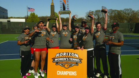 The Youngstown State University women's tennis team poses with the Horizon League championship trophy after winning the conference championship on April 26. The Penguins will travel to Los Angeles to play the University of Southern California in the first round of the NCAA tournament. Photo courtesy of YSU Sports Information. 
