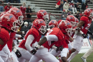 The Youngstown State University football team runs onto the field before the team's game against Missouri State University.