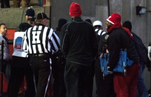 Angry Youngstown State University fans wait in front of the tunnel as the referees from Saturday's game leave the field. 