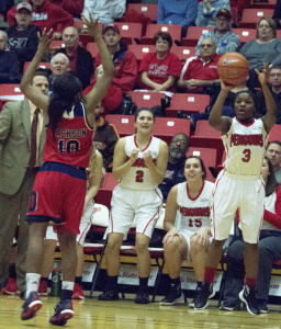 Youngstown State University point guard Indiya Benjamin shoots a 3-pointer to take a 68-65 lead with one minute remaining.