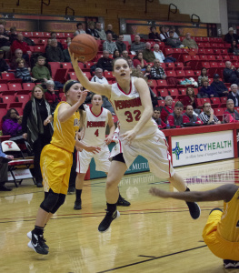 Youngstown State University guard Jenna Hirsch (32) gets fouled and makes the layup.