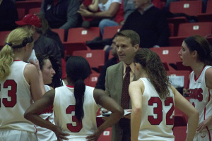 John Barnes, head coach of the Youngstown State University women's basketball team, draws up a play during a timeout.