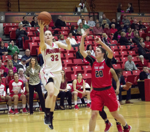Youngstown State University guard Jenna Hirsch drives for a contested layup in the Penguins' win over Stony Brook University.