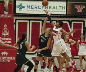 Youngstown State University's Janae Jackson (44) fights with University of Wisconsin Green Bay's Mariah Monke (44) for a rebound.