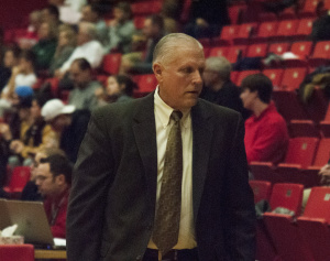 Jerry Slocum, Head Coach of the Youngstown State University men's basketball team, walks down the sidelines during a game.