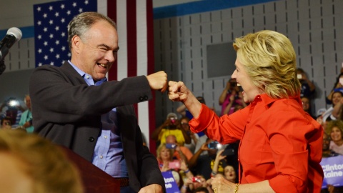 Democratic Party Presidential nominee Hillary Clinton and Vice Presidential nominee Tim Kaine bump fists upon arriving at Youngstown's East High School on Saturday. (Photo courtesy of Scott Williams)