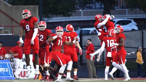 The Youngstown State University football team celebrates a win at Stambaugh Stadium. 