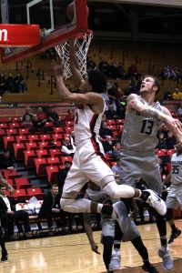 Youngstown State University's Devin Haygood avoids a block attempt as he drives for a layup.